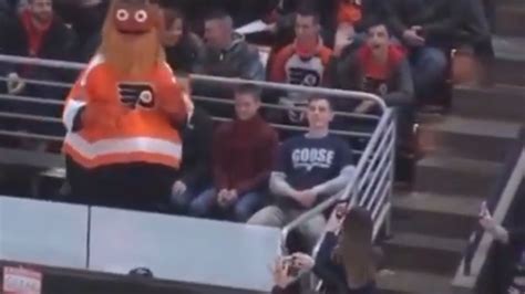 Mascot throws cake in fans face